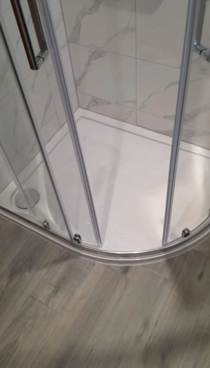 Quadrant shower tray with sliding glass door